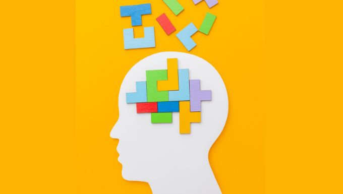 Illustration d'une tête de profil avec des éléments du jeu Tetris s'y imbriquant pour former un cerveau.