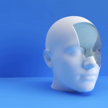 Un visage humain modélisé en 3D sur fond bleu.