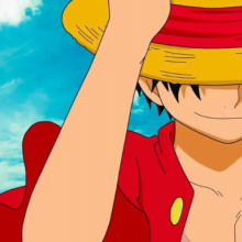 Luffy héros de One piece en gros plan, souriant sous son chapeau
