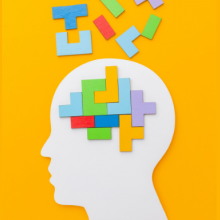 Illustration d'une tête de profil avec des éléments du jeu Tetris s'y imbriquant pour former un cerveau.